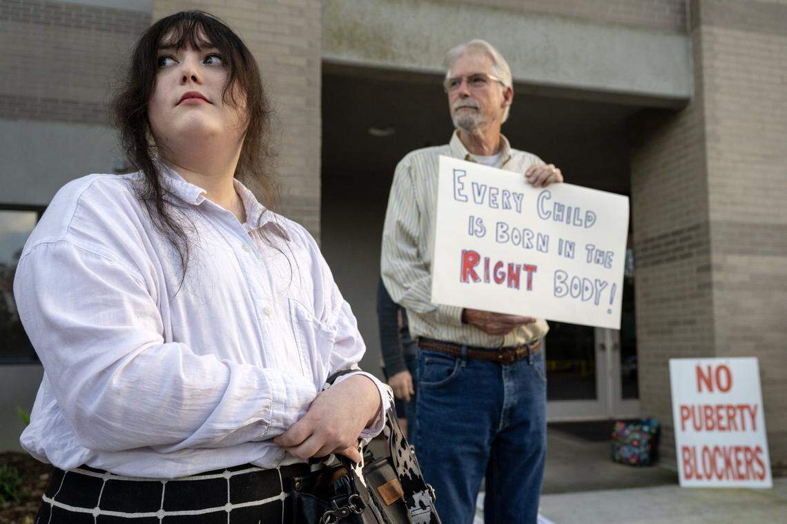 Activist Layla Jane, 21, protests alongside Daniel Russell and other anti-trans demonstrators outside the Elk Grove Unified School District offices on Tuesday.