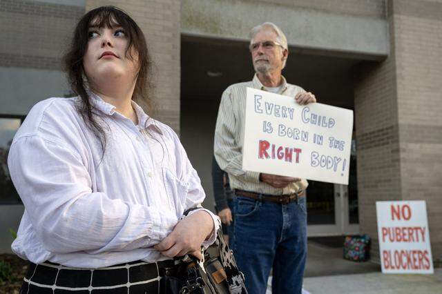Activist Layla Jane, 21, protests alongside Daniel Russell and other anti-trans demonstrators outside the Elk Grove Unified School District offices on Tuesday.