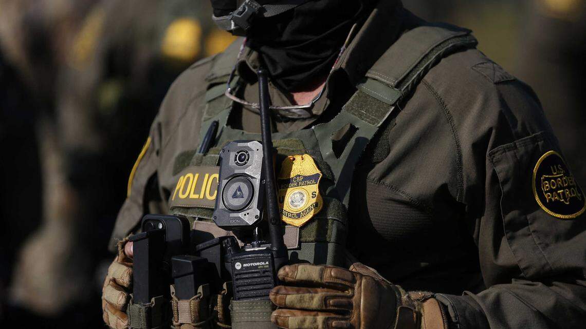 A U.S. Customs and Border Protection agent stands guard near a crowd of protesters outside an Immigration and Customs Enforcement facility in Broadview, Ill., on Oct. 3, 2025. A report published Wednesday by the San Francisco Chronicle says the Trump administration has dispatched federal law enforcement agents to the Bay Area for an upcoming operation.
