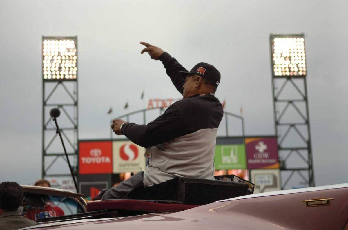 Giants legend Willie Mays tosses ball to fans during the pre-game at the 2007 All-Star Game at AT&T Park in San Francisco. The Hall of Famer center fielder and a slugging icon died Tuesday, June 18, 2024, at the age of 93, the Giants organization announced.