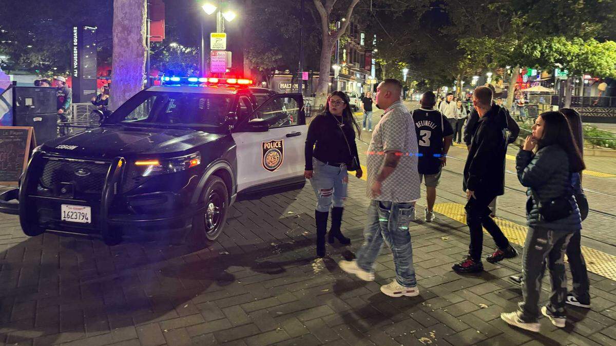 Crowds and police are seen outside of Downtown Commons after roughly 30 people ran on K Street from the Downtown Commons toward 8th Street on Friday, Oct. 25, 2024.The panic was caused by fireworks, not gunfire, police on the scene confirmed.