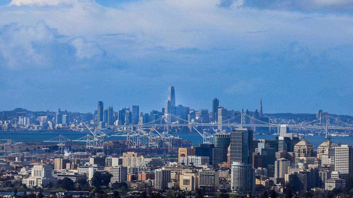 Tumultuous clouds move over the San Francisco Bay Area seen from the hills of Oakland after raining on Friday. Some California airports are seeing flight delays and cancellations, following the recent atmospheric river.