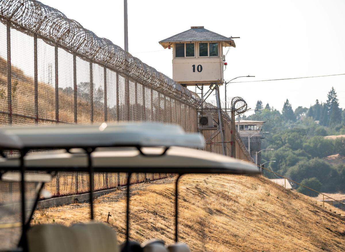 A guard tower stands at Folsom State Prison in August. Overtime spending at the Department of Corrections and Rehabilitation grew 95% over the past decade, reaching $703 million last year.