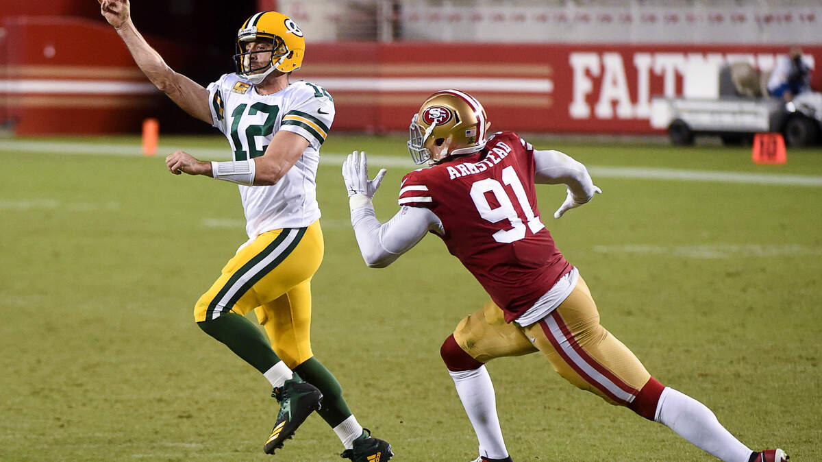 San Francisco 49ers defensive end Arik Armstead (91) pressures Green Bay Packers quarterback Aaron Rodgers (12) in the third quarter during a game at Levi’s Stadium on Thursday, Nov. 5, 2020, in Santa Clara.