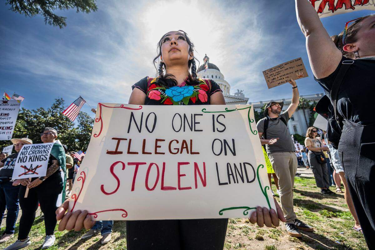 Jaqueline Chavez, of Sacramento, participates in the “No Kings” protest at the state Capitol on Saturday, June 14, 2025. “I’m here because there’s a lot people that I think would like to be here but they can’t. I’m here for them because I have the privilege to do so,” Chavez said.