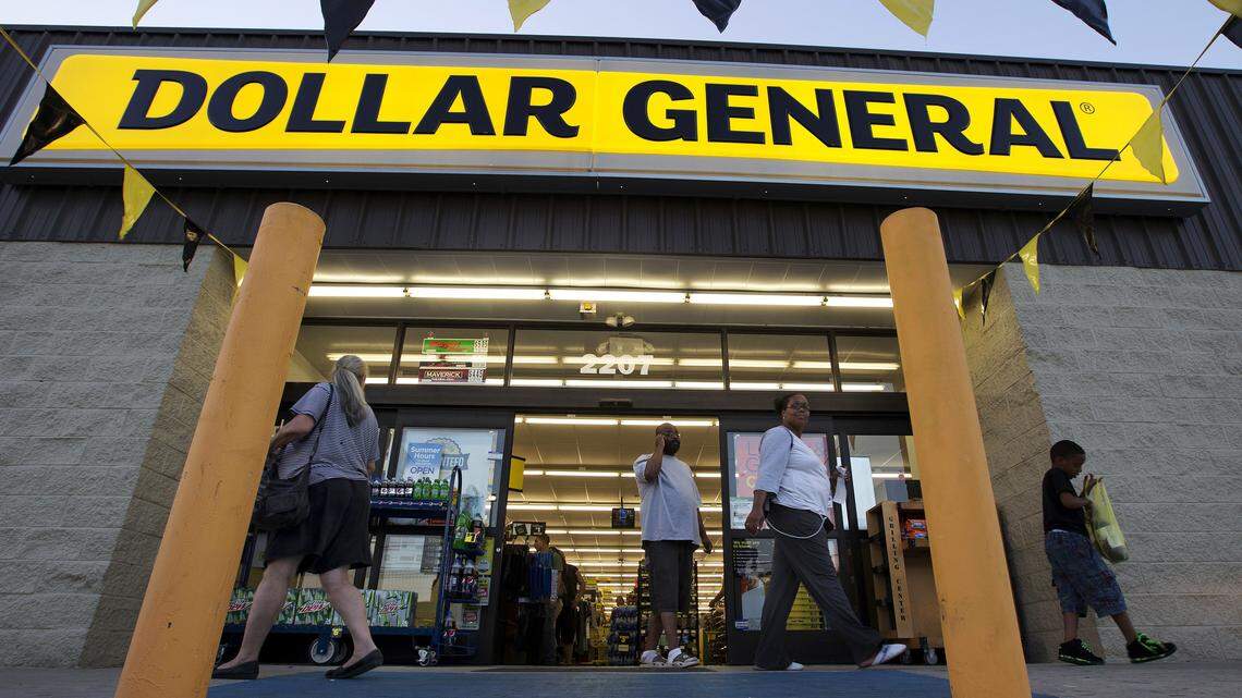 FILE -- In this Wednesday, Sept. 25, 2013, file photo, customers exit a Dollar General store in San Antonio. Owners of a small market in Redwood Valley, Calif., blocked a Dollar General store from being built across the street by buying the vacant property from the developers, Cross Development.