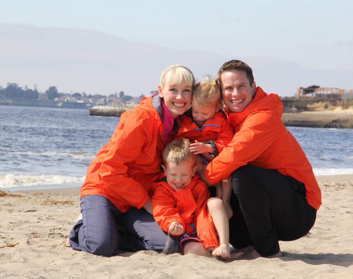 Sherri Papini poses on a beach with her husband, Keith, and children in a family photograph.