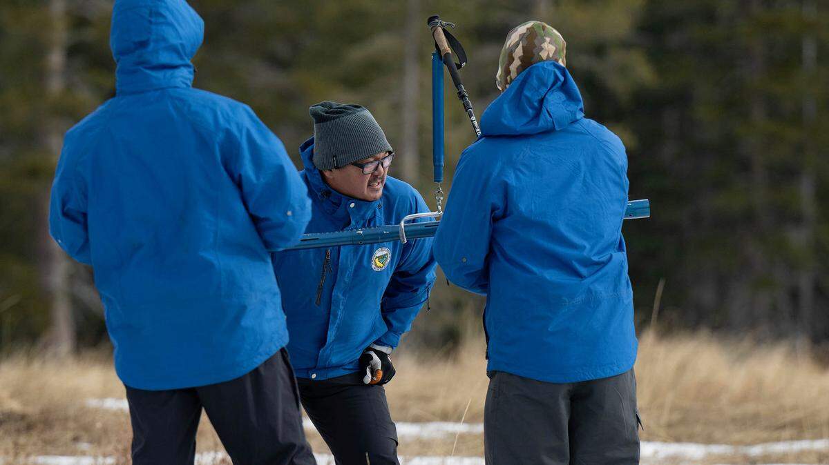 Sean de Guzman, center, snow survey manager at the Department of Water Resources, conducts the first snow survey of the season with his team at Phillips Station in El Dorado County on Tuesday, Jan. 2, 2024.