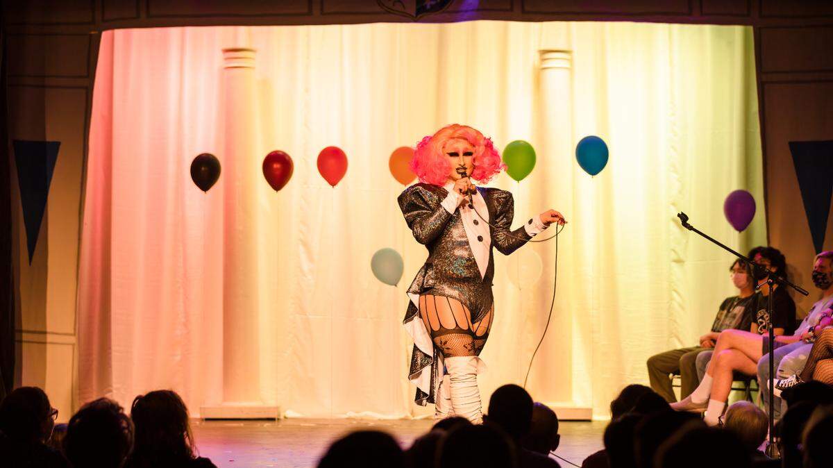 Drag queen Iris Omega performs in Loomis’ McLaughlin Theatre.