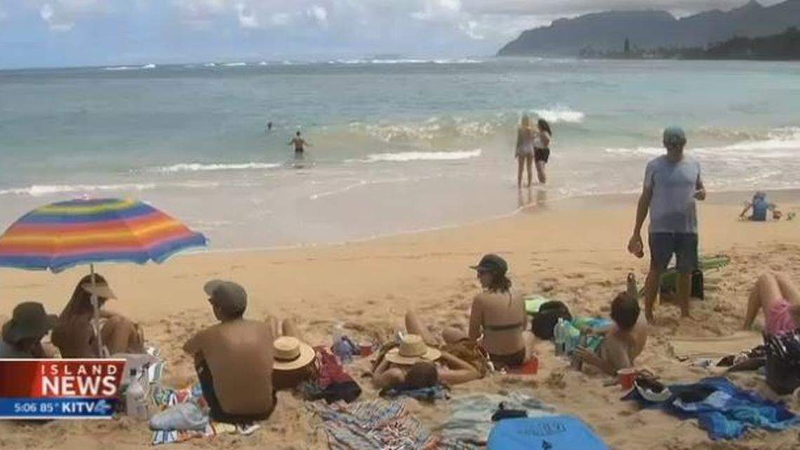 Fellow surfers carried a 23-year-old man to safety on their surfboards after he was attacked Saturday morning by a shark off Pounders Beach on Oahu. The man underwent surgery for an arm wound.