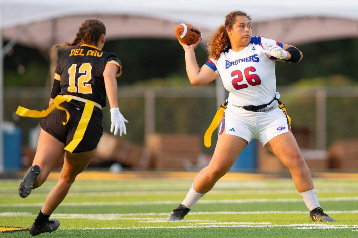 Christian Brothers Falcons quarterback Venezia Martinez (26) throws the ball during the first half at Del Oro High School on Monday.