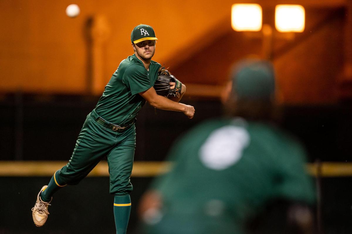 Rio Americano pitcher Chase Christenson throws the ball to first baseman Brady Wilson to keep a Granite Bay runner close to first during the second inning of the Sac-Joaquin Section Division II championship high school baseball game Tuesday, May 24, 2022, at Sacramento City College.