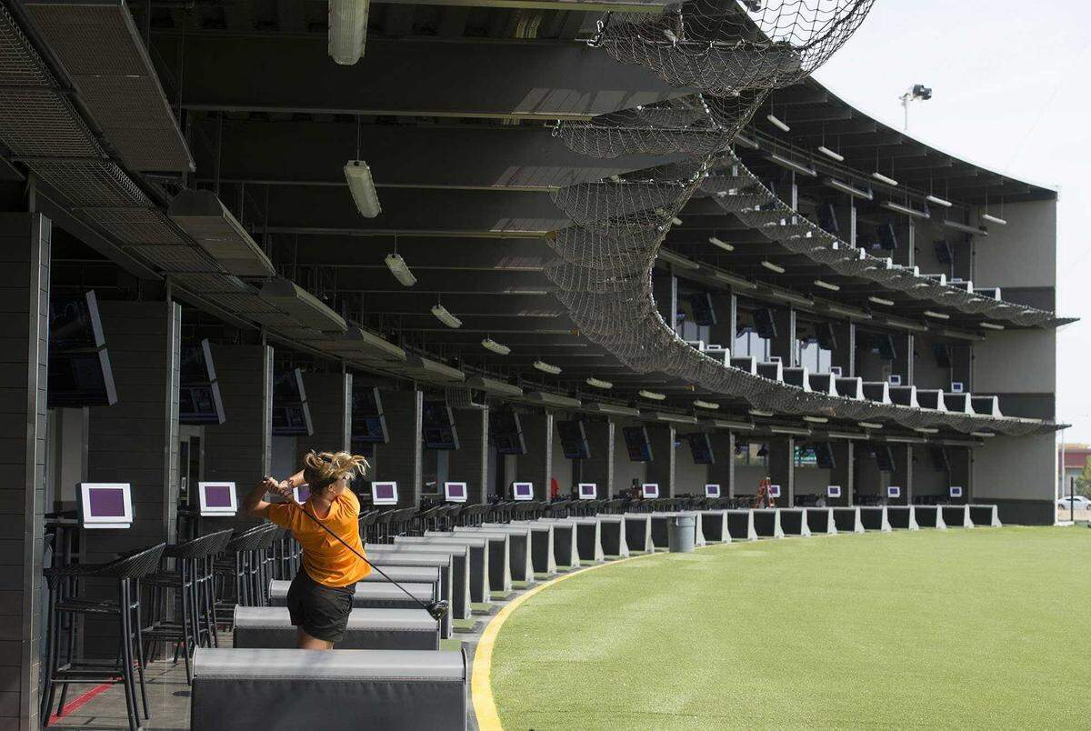 Nicole Schroeder, 17, of Rocklin, hits a ball at Topgolf in Roseville in August 2016.