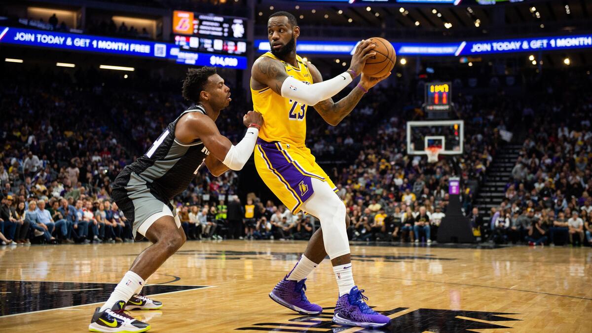 Los Angeles Lakers forward LeBron James (23) keeps the ball away from Sacramento Kings guard Buddy Hield (24) in the second half at Golden 1 Center on Saturday, Feb. 1, 2020, in downtown Sacramento. The Lakers went on to beat the Kings 129-113.
