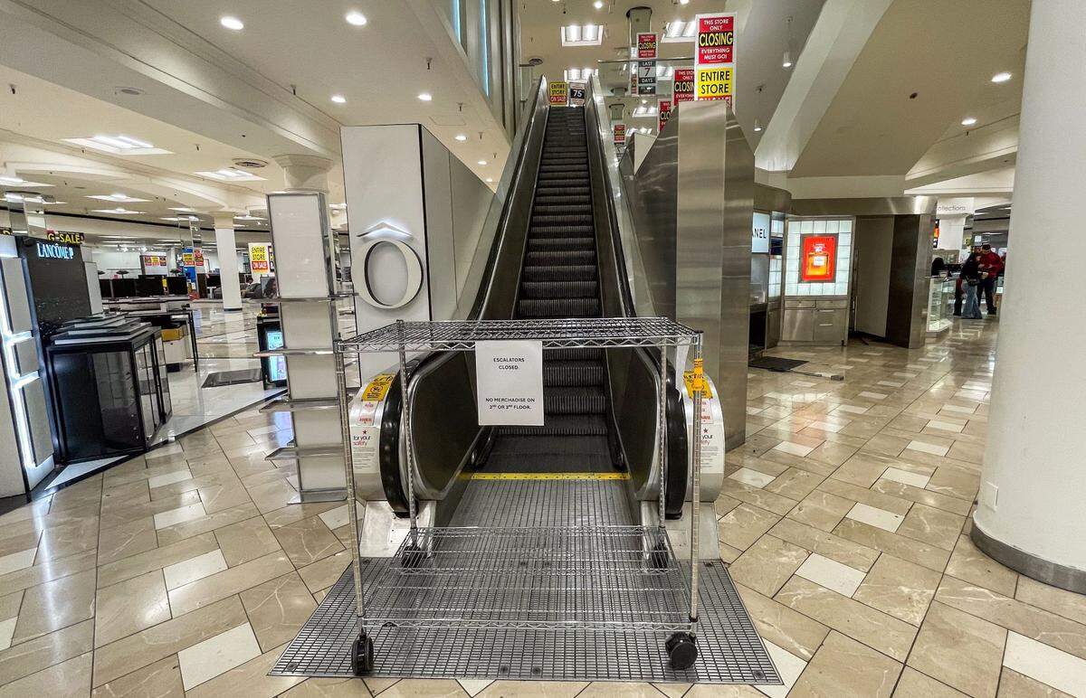 A cart blocks the escalator at the Downtown Commons Macy’s store in Sacramento on Thursday. All sale items are located in the main floor. 