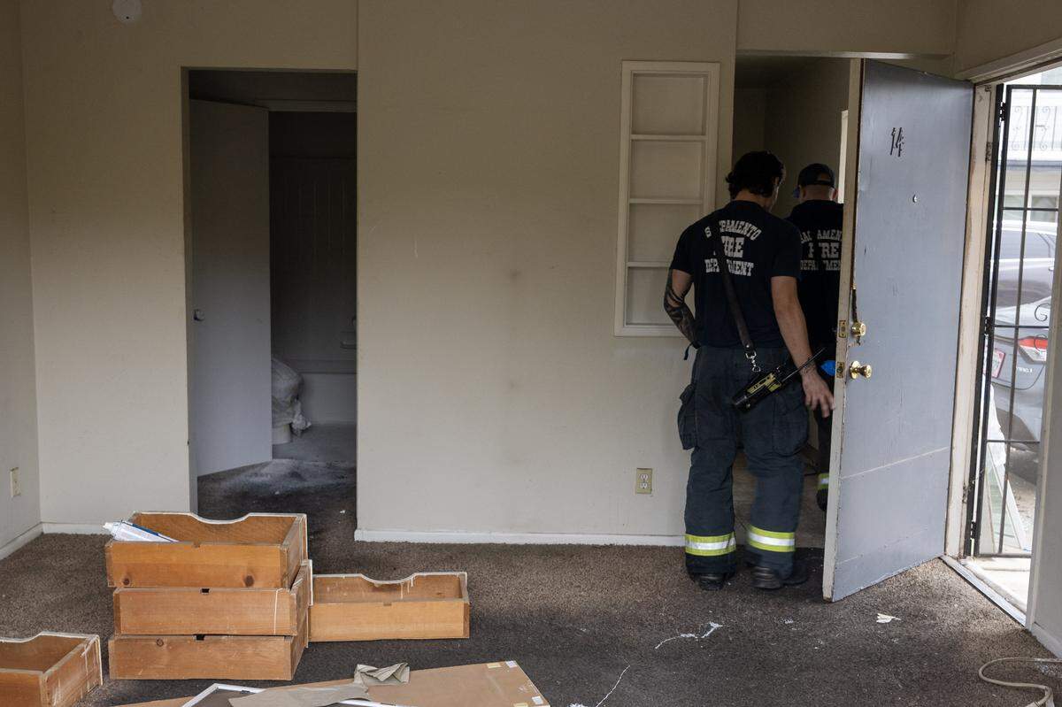 Sacramento Fire Department investigators inspect an apartment after fumes from a paint crew were ignited by the pilot light of a gas stove, causing an explosion at 5478 Carson Drive on Tuesday, Dec. 9, 2025, in Sacramento.