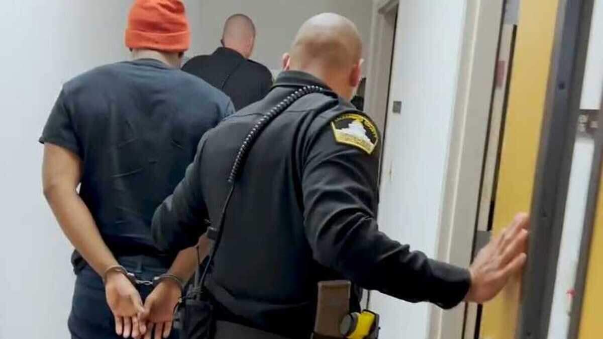 In a photo released by the Sacramento County Sheriff’s Office, Demetrius Davis is led away in handcuffs at a sheriff’s substation on April 26, 2022. Davis is suspected of using social media to lure over 80 children in U.S. into performing sex acts online. California Gov. Gavin Newsom on Friday, May 13, 2022, called for continuing to fund the state’s Internet Crimes Against Children Task Force.