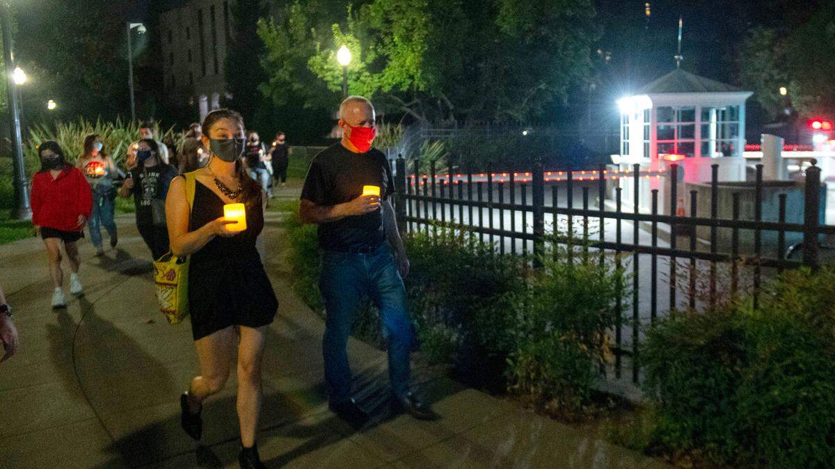 Kelly Fong-Rivas, chief of staff for Sacramento Mayor Darrell Steinberg, right, participates in a candlelight walk around the state Capitol grounds to honor the late U.S. Supreme Court Justice Ruth Bader Ginsburg in September 2020. Fong-Rivas will assume the role of racial equity adviser beginning May 16.