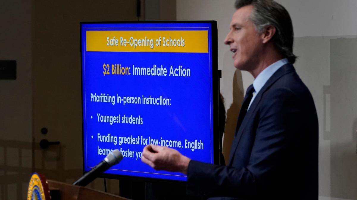 California Gov. Gavin Newsom outlines his 2021-2022 state budget proposal during a news conference in Sacramento on Friday, Jan. 8, 2021. Newsom’s budget will include at least $2 billion to help schools with testing, increased ventilation and personal protective equipment.