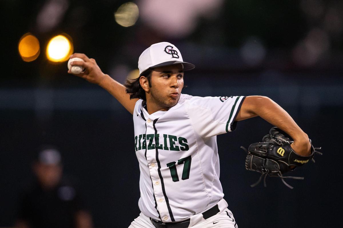 Granite Bay’s Jack Guhfran pitches to Rio Americano’s Davis Grawey during the first inning of the Sac-Joaquin Section Division II championship high school baseball game Tuesday, May 24, 2022, at Sacramento City College.