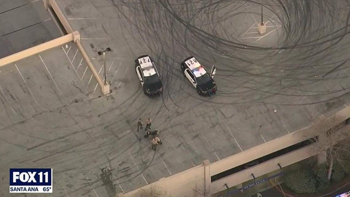 A woman died when her motorcycle hit a wall on a three-story parking garage, sending her flying over the edge in Santa Clarita, California, officials say.