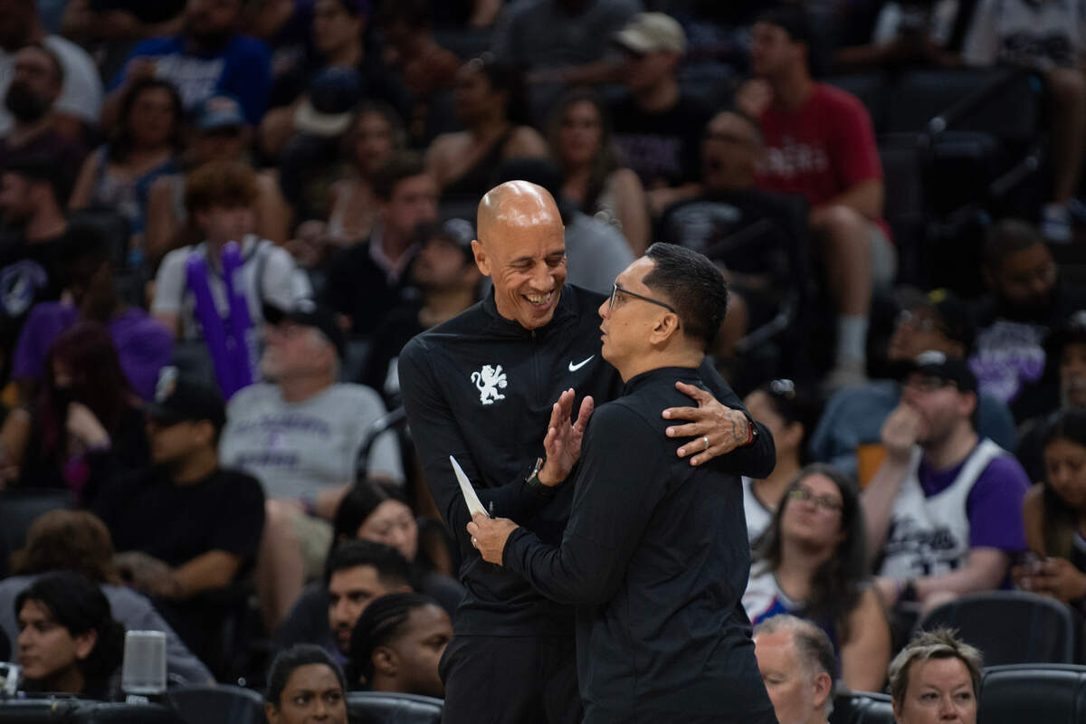 Sacramento Kings summer league coach Doug Christie embraces coach Jimmy Alapag, right, during the first half of the California Classic Summer League game between the Kings and the Chinese National team at Golden 1 Center on Saturday, July 6, 2024.