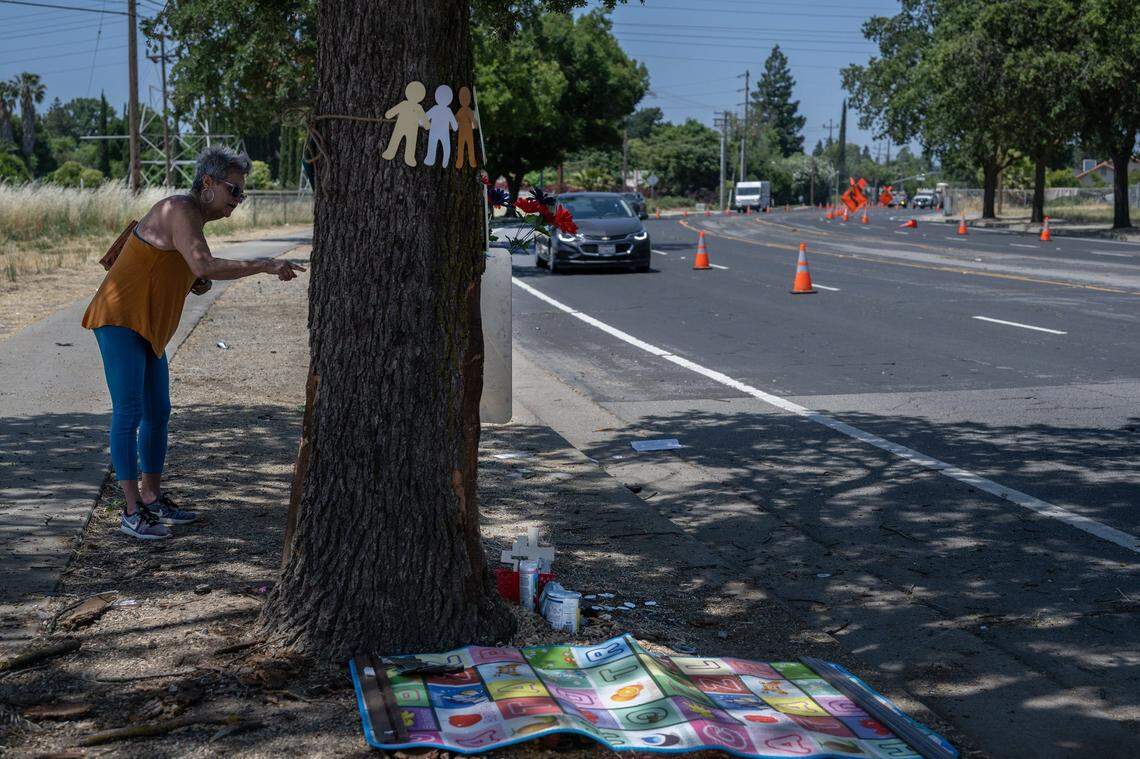 Marbella Sala, president of the Gardenland Northgate Neighborhood Association, speaks in June about the dangers of San Juan Road on the day after Rayshawna Armstrong and two children died and eight more were injured.