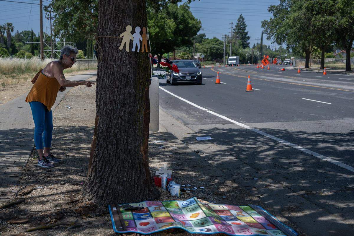 Marbella Sala, president of the Gardenland Northgate Neighborhood Association, speaks Thursday, June 1, 2023, about how dangerous the road was at the scene of a car crash on San Juan Road in Sacramento where three people died and eight more are injured the night before. At least two dozen crashes have occurred at the same curve since 2011.