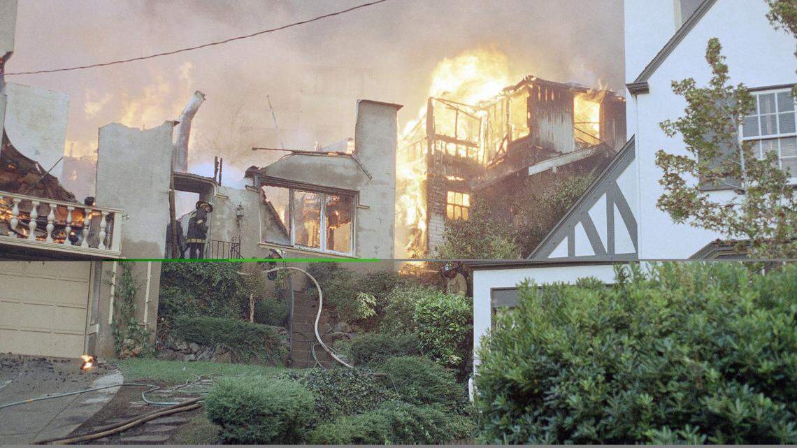 Firefighters spray water on the remains of a burning house in the Rockridge area of Oakland, California on Sunday, Oct. 20, 1991. Hundreds of homes were destroyed by the blaze. (AP Photo/Glenn Morimoto)