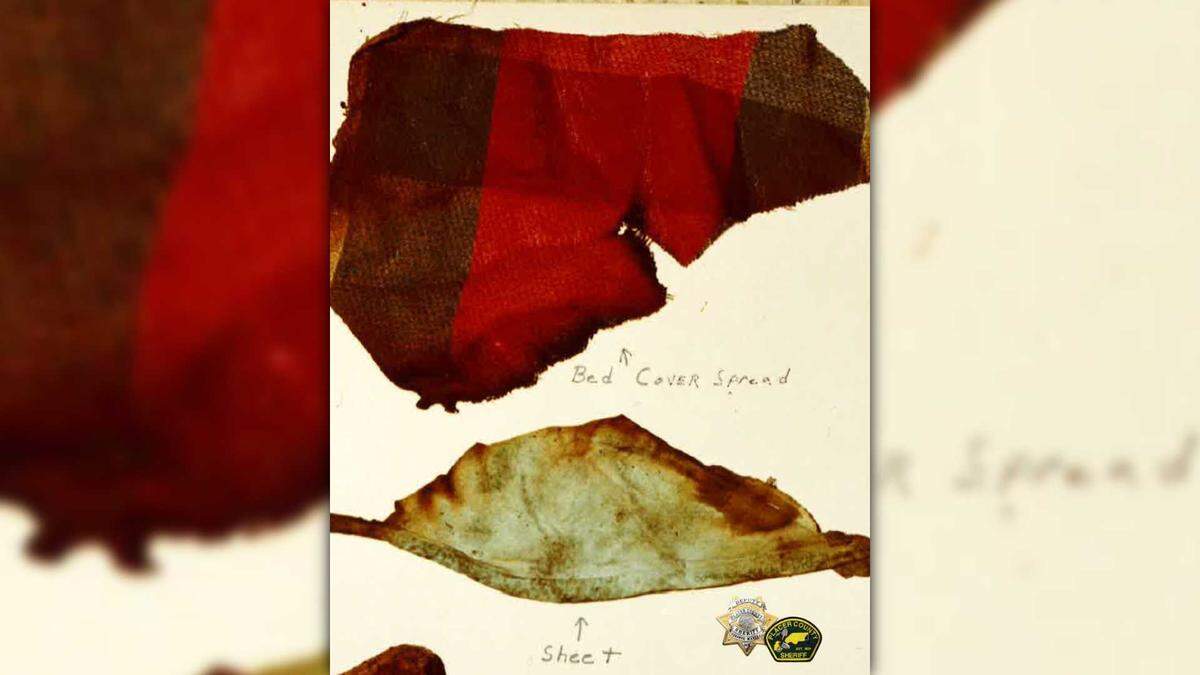 Shreds of a bed cover and sheet are seen in an evidence photograph taken in 1972. Cold case investigators say the bedding, which appeared to come from a hospital or care facility, could help confirm the identity of a man whose burned body was found in Placer County more than 50 years ago.