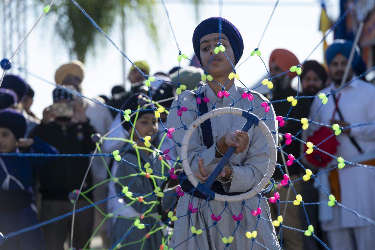 Children perform before the Nagar Kirtan, also known as the Sikh Parade, in Sutter County on Sunday, Nov. 2, 2025.