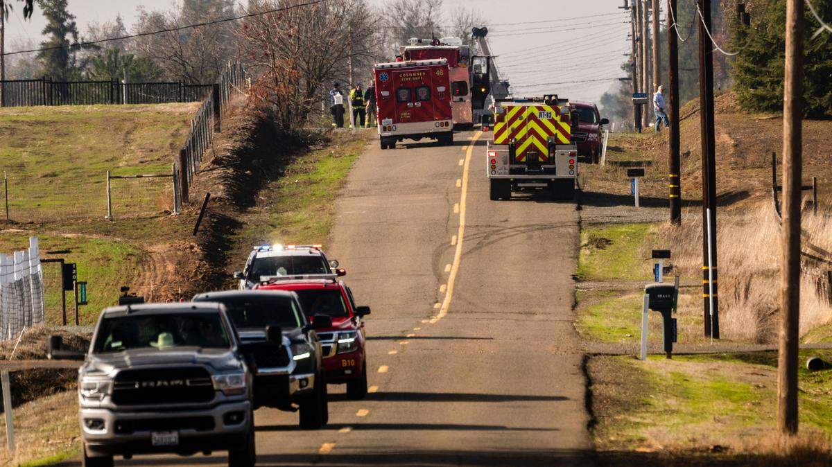 Emergency vehicles on Walmort Road respond to an overturned propane tanker that caused mandatory evacuations in Wilton on Sunday.