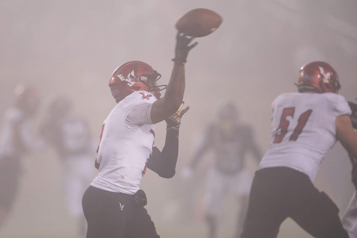 Eastern Washington Eagles quarterback Eric Barriere (3) passes in a foggy fourth quarter against UC Davis during in 2021 at UC Davis Health Stadium. EWU beat UC Davis 38-20 in the Big Sky Conference game.
