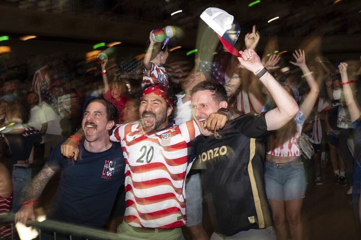 United States fans cheer during a watch party at Memorial Auditorium in Sacramento on Wednesday as the U.S. men's soccer team faced off against Bosnia and Herzegovina in the World Cup. The game, which the U.S. won 2-0, was played in Santa Clara.