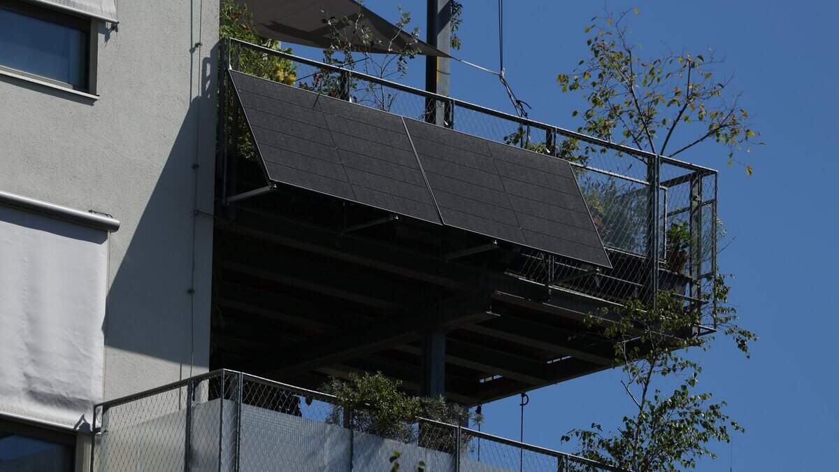 BERLIN GERMANY - AUGUST 18: Solar energy panels hang from a balcony at a residential apartment building on August 18, 2025 in Berlin, Germany. Balcony solar panels have becoming increasingly popular across Germany following new legislation introduced last year that simplified the bureaucracy and permitting related to installation. (Photo by Sean Gallup/Getty Images)