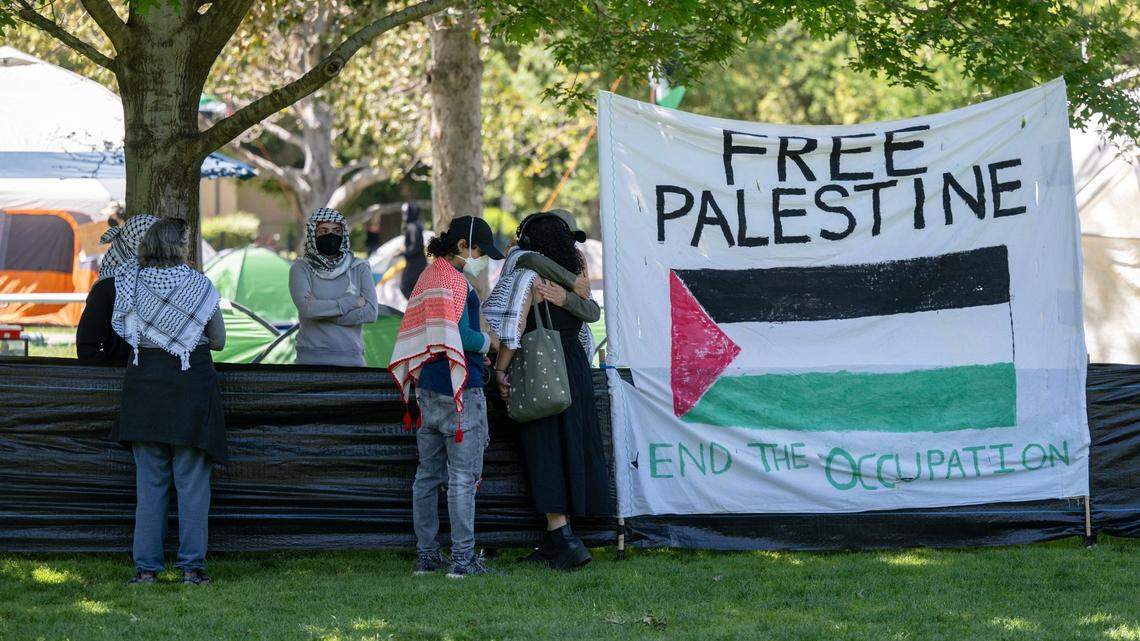 A flag reading “Free Palestine – end the occupation” is displayed at a pro-Palestinian encampment erected at UC Davis in 2024. The Davis City Council voted unanimously Tuesday to acknowledge discrimination against Muslims, Arabs and Palestinians in the city during a contentious, hourslong meeting.