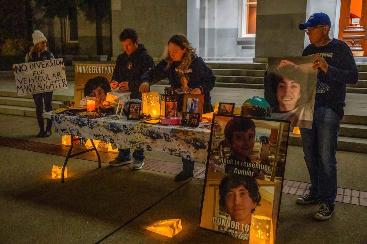 Allison Lyman, center, sets up a display for her son Conor Lopez on the World Day of Remembrance for Road Traffic Victims at the state Capitol on Sunday. Lopez, 23, died in April when a car hit him while he was riding his motorcycle in Elk Grove. 