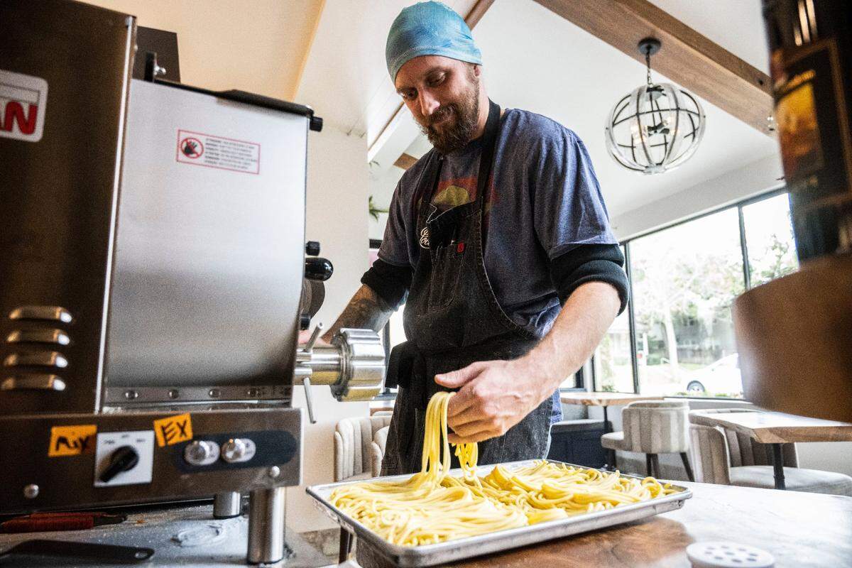 Prep cook Matthew Strong prepares fresh pasta at Localis in midtown Sacramento on Dec. 9. The restaurant features a communal spirit, with employees collectively voting on hirings and firings, menu changes and public statements.
