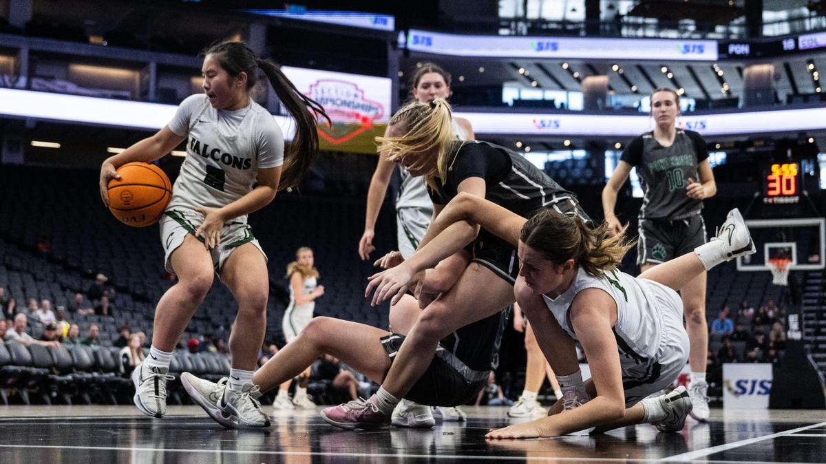 Colfax Falcons point guard Belle Chu (2) steals the ball against Ponderosa during a CIF Sac-Joaquin Section Division III girls basketball championship game at Golden 1 Center on Friday.