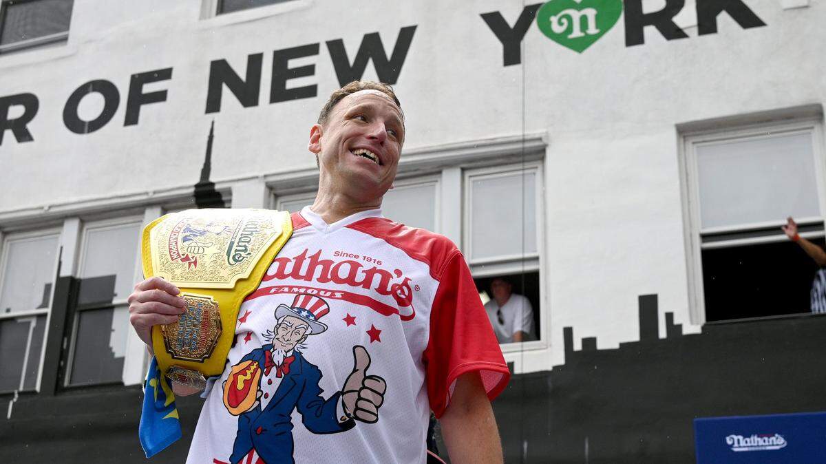 Competitive eater Joey Chestnut posed for pictures after winning the Fourth of July International Hot-Dog Eating Contest, Coney Island, in the Brooklyn borough of New York, NY, July 4, 2023.  (Photo by Anthony Behar/Sipa USA)