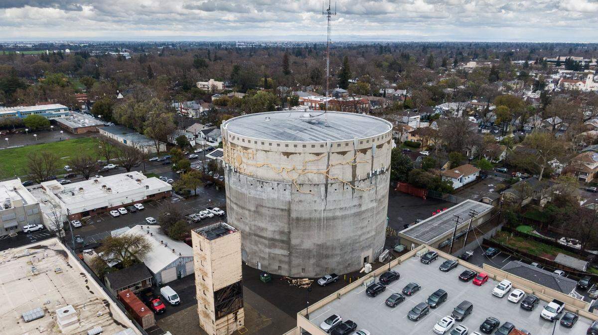 The city water tank in East Sacramento is seen from a drone on March 21. The inside of the tank was vandalized with graffiti by graduating members of the fire department, creating floating debris and damage that cost taxpayers $65,000.