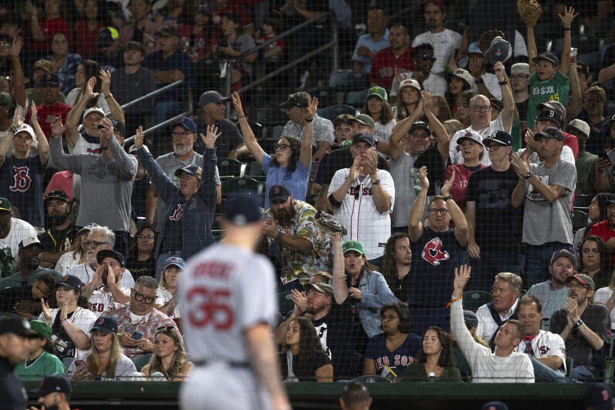 Red Sox fans react after a pitch from Boston Red Sox pitcher Garrett Crochet (35) during a game between the Athletics and the Red Sox at Sutter Health Park in West Sacramento on Monday, Sept. 8, 2025.