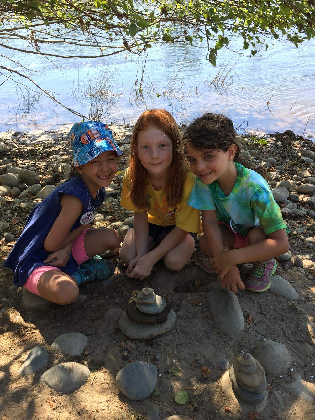 The Effie Yeaw Nature Center’s day campers stack rocks near the American River. These camps focus on helping kids develop useful skills including local wildlife tracking, robotics and developing video games.