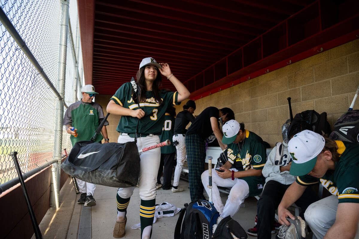 Kennedy Cougars team captain Laney Fukuoka walks out of the dugout in her uniform after the game against the Antelope Titans on Monday. Fukuoka pitches and plays first base for the Kennedy Cougars varsity baseball team.