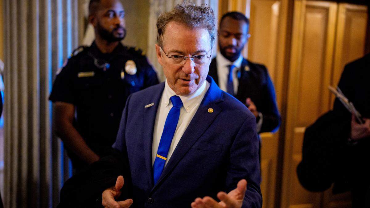 Sen. Rand Paul, R-Ky., walks into the Senate Chamber on Thursday, Dec. 11, 2025, in Washington, D.C. Two opposing health care bills intended to avert rising health care premiums failed in the chamber.