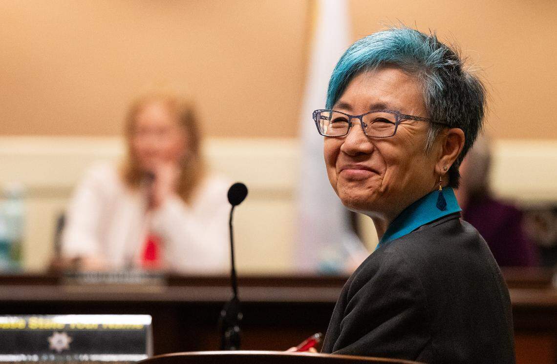 Cynthia Dai, who served on the first California Citizens Redistricting Commission in 2010 and opposes the current proposal to redistrict the state, listens during public comment against the plan during an Assembly Elections Committee hearing at the state Capitol in August.