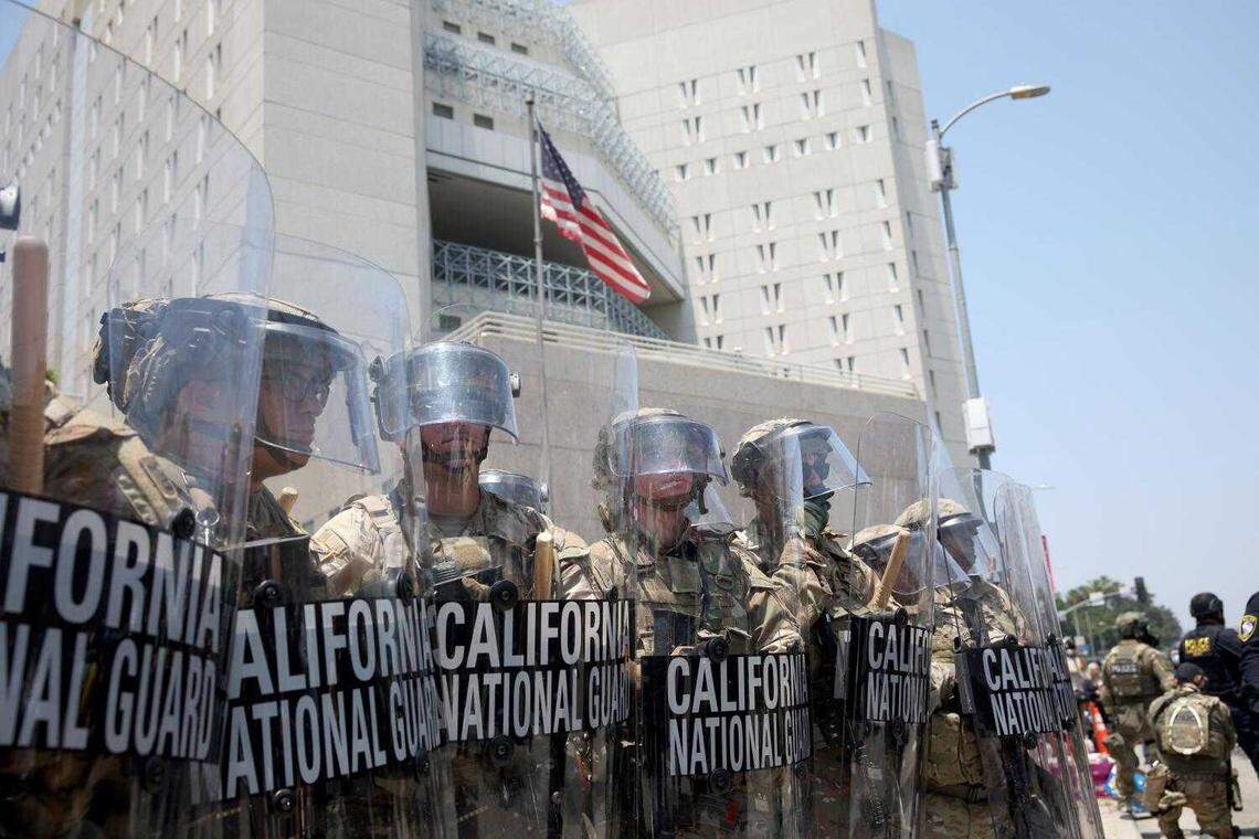National Guard troops stand outside the Metropolitan Detention Center in Los Angeles on Sunday, part of a controversial federal deployment ordered by President Donald Trump amid statewide protests over immigration raids.