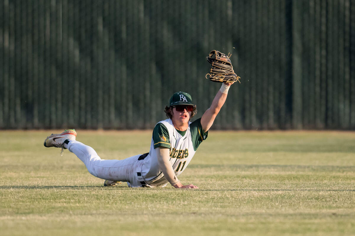 Rio Americano Raiders Kyle Wirtz (11) holds his glove up with a fly ball caught from Granite Bay Grizzlies batter Chase Bentley (21) to end their sixth inning at-bat with two runners on base during the CIF Sac-Joaquin Section Division II high school baseball championship game Thursday at Sacramento City College. The Grizzlies beat the Raiders for the title for the second year in a row.