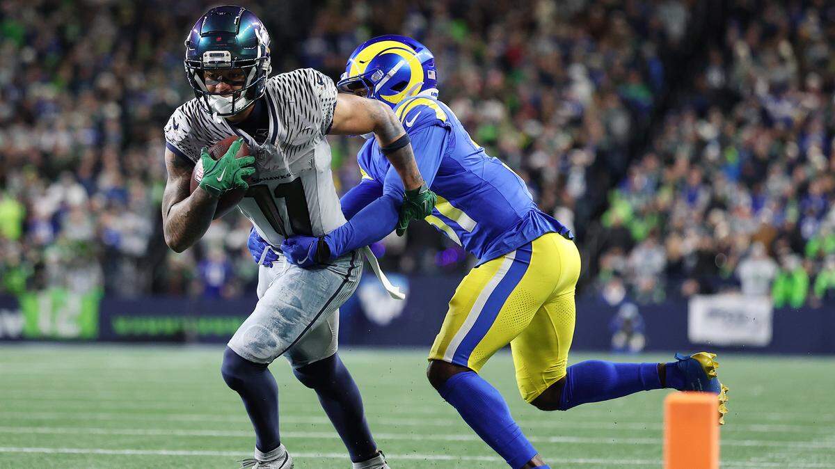SEATTLE, WASHINGTON - DECEMBER 18: Jaxon Smith-Njigba #11 of the Seattle Seahawks runs with the ball during the fourth quarter against the Los Angeles Rams at Lumen Field on December 18, 2025 in Seattle, Washington. (Photo by Steph Chambers/Getty Images)
