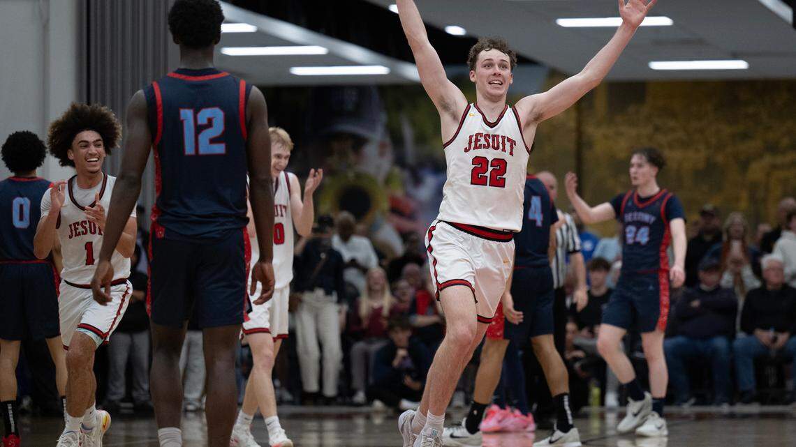 The Jesuit Marauders’ Asher Schroeder (22) celebrates the CIF Northern California Division II boys basketball championship following the 65-55 victory over the Destiny Christian Lions on Tuesday in Carmichael.